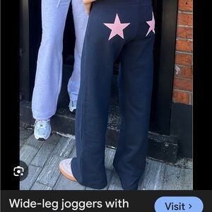 Subdued wide legged joggers with pink stars